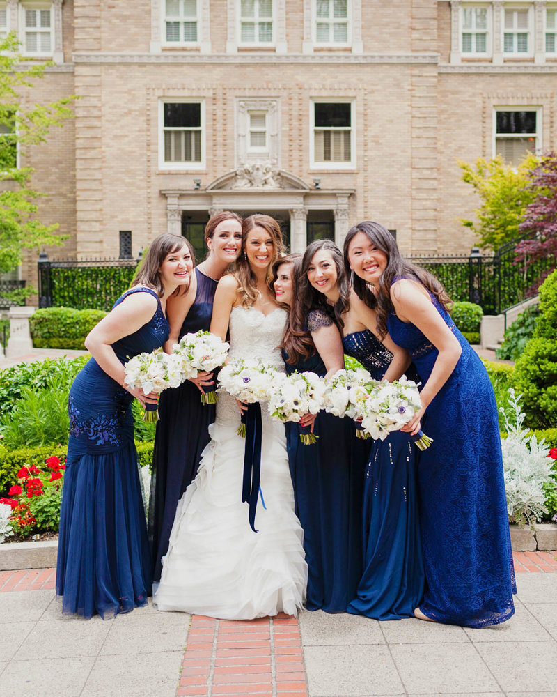 Bridal Party surrounding Bride with bouquets