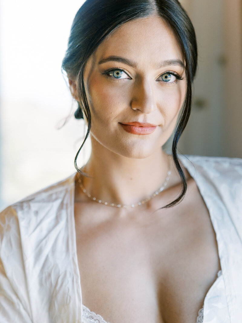 L1530005 wedding reception party as the bride laughs in the groom dances with her during the wedding reception at their California luxury wedding