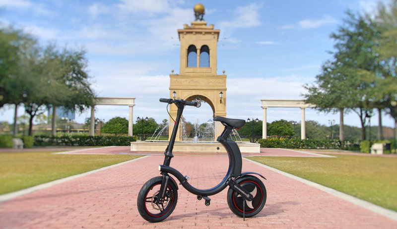Black Go-Bike Q1 in front of water fountain