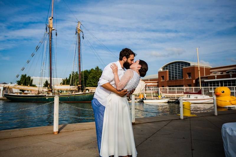 Bride and groom kiss outside of the Maritime Museum in Downtown Erie, PA