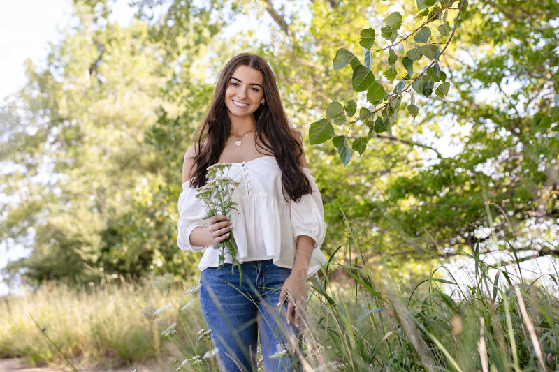 Beautiful high school senior in a lush park in natural light by Northeast Ohio senior photographer, Sharon Holy