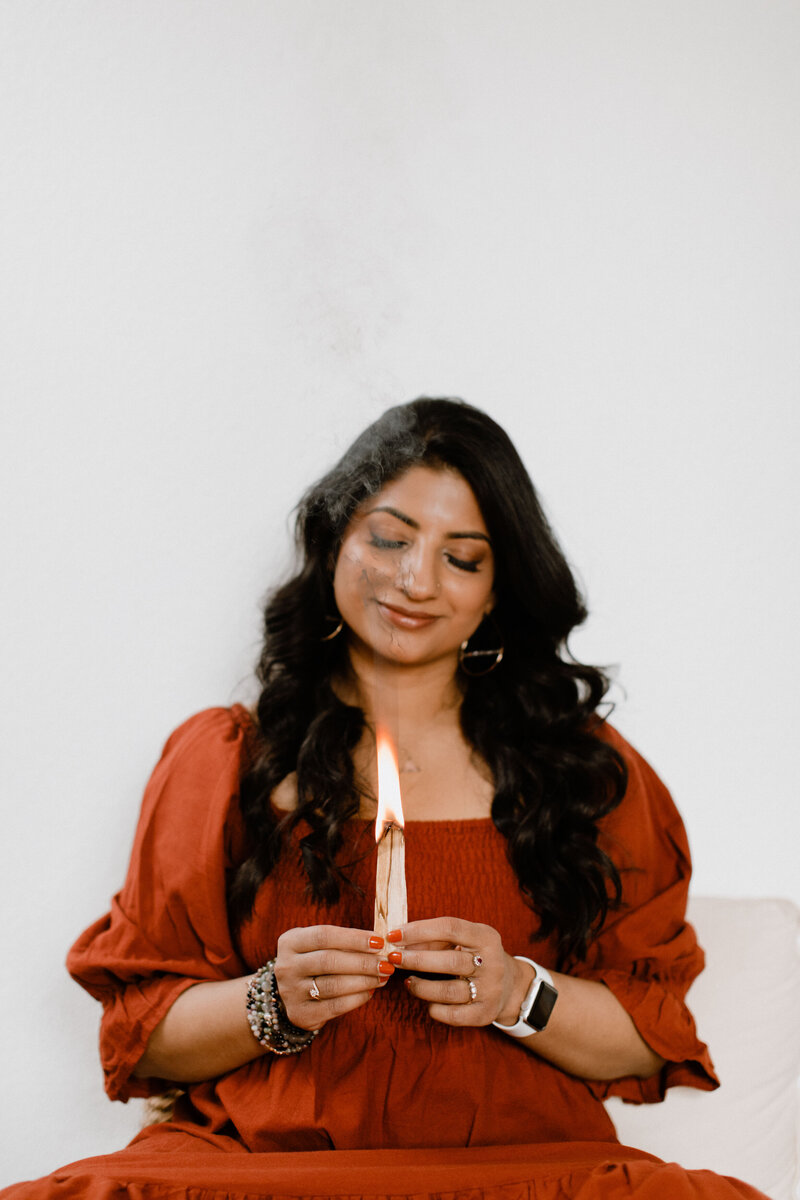 Mindfulness coach Radhika burning herbs