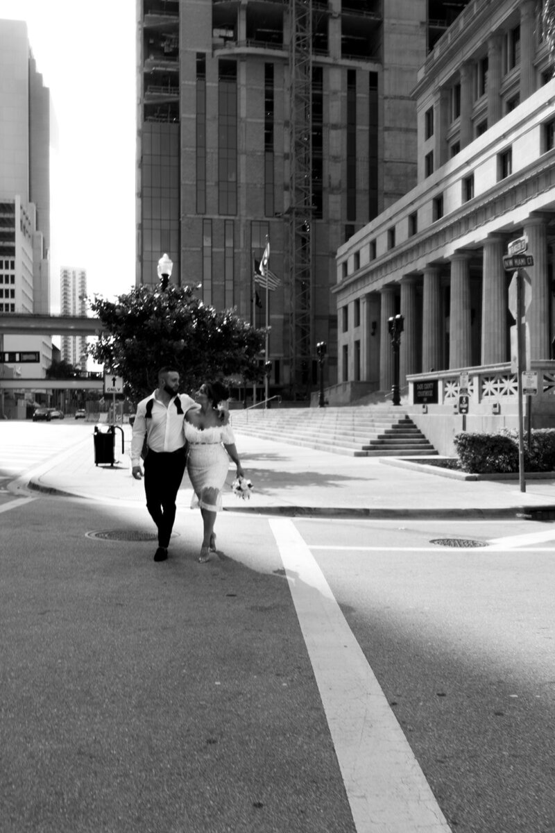 bride-and-groom-walk-down-street
