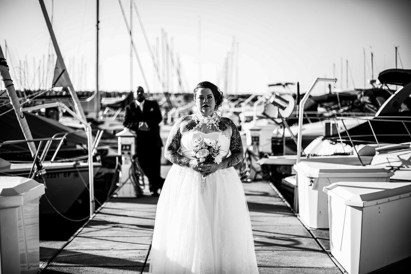 Groom watches bride from the transient dock at the Erie Yacht Club