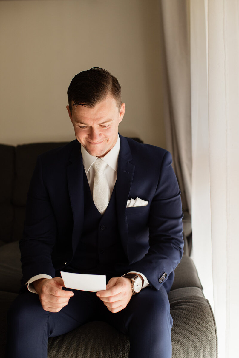 Groom reading the letter from the bride