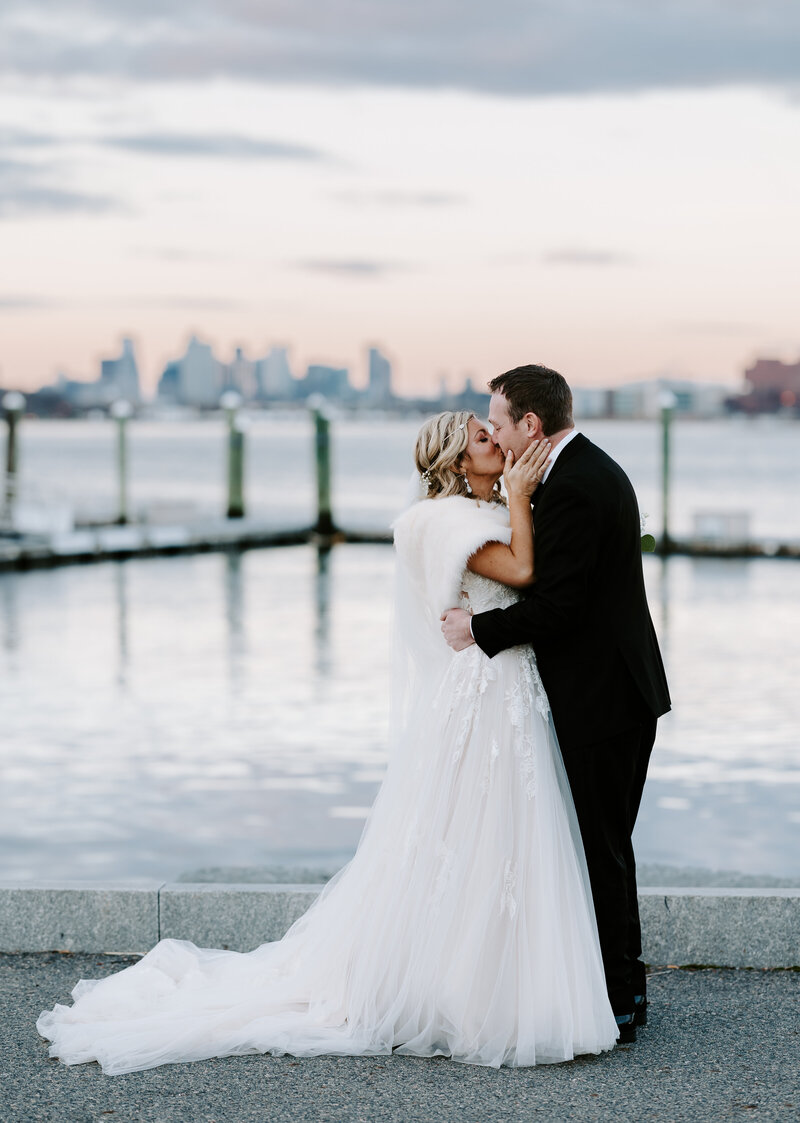 Bride and groom kiss after first look in the sunset in Boston, Massachusetts
