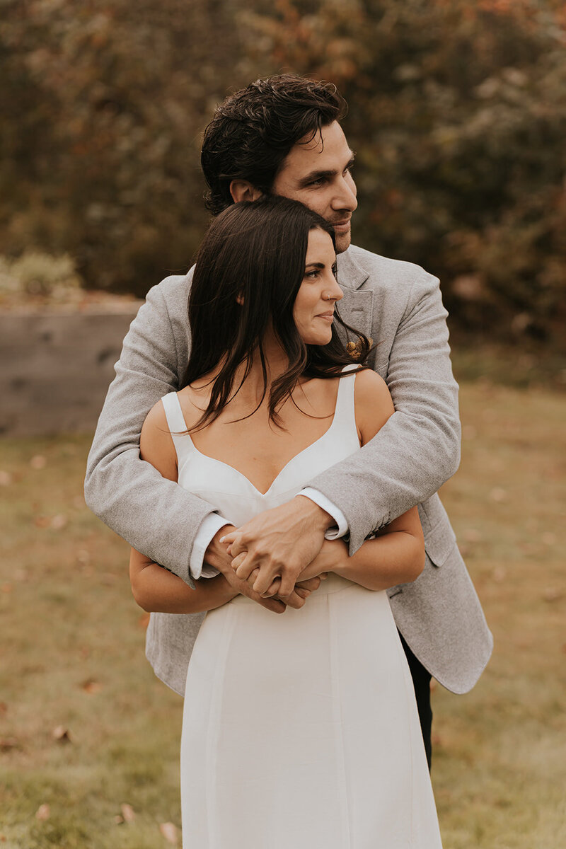 Couple hugging after New England wedding
