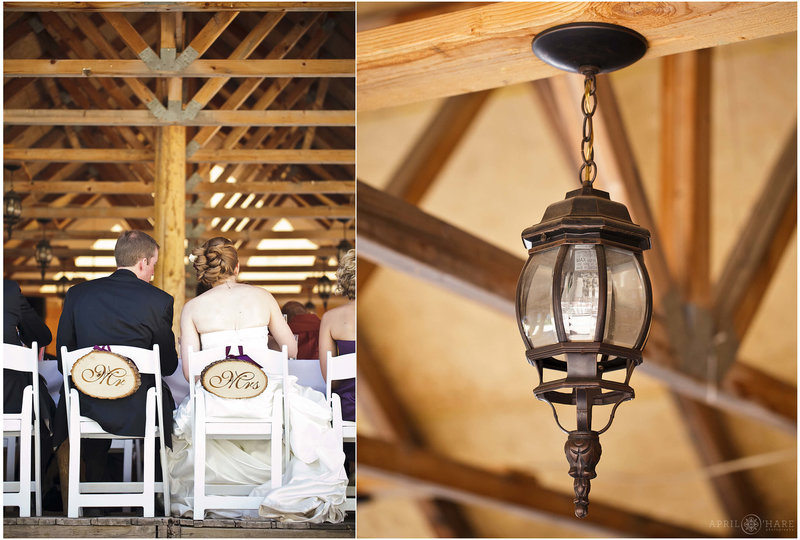 Rustic lantern hangs from outdoor Piney RIver Ranch wedding reception