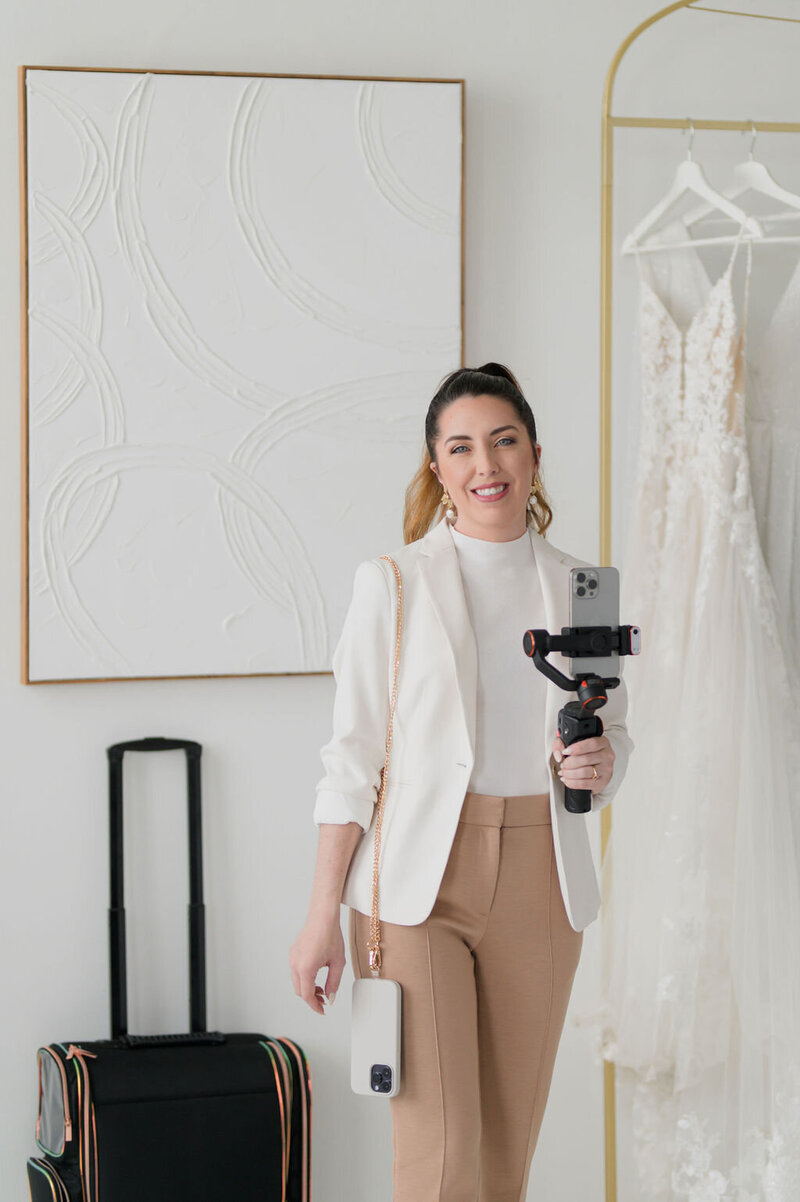 kaylyn leighton photographing a beautiful floral seating chart to offer content creation to couples and vendors.