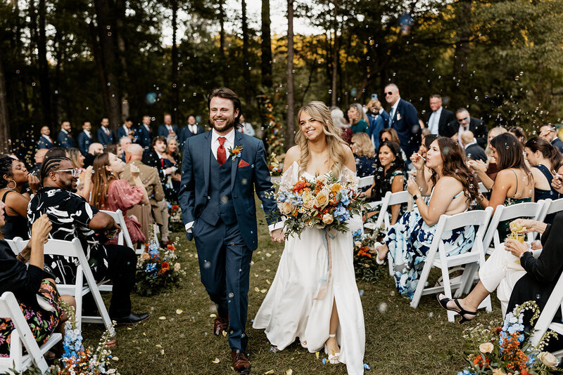 couple walking out of wedding ceremony
