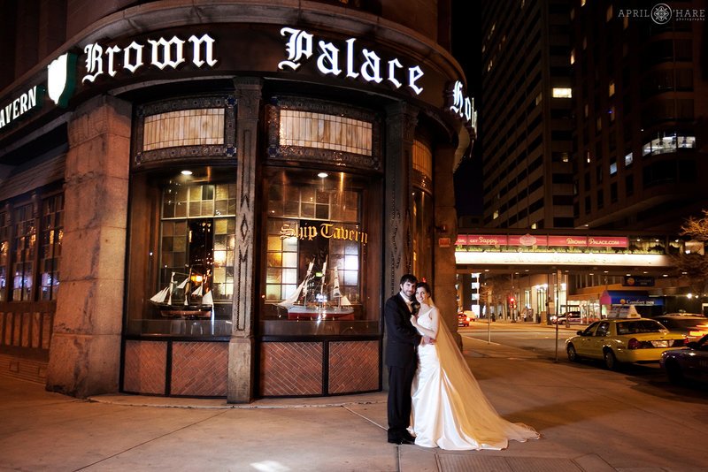 Night wedding portrait outside of the Brown Palace Hotel in Denver