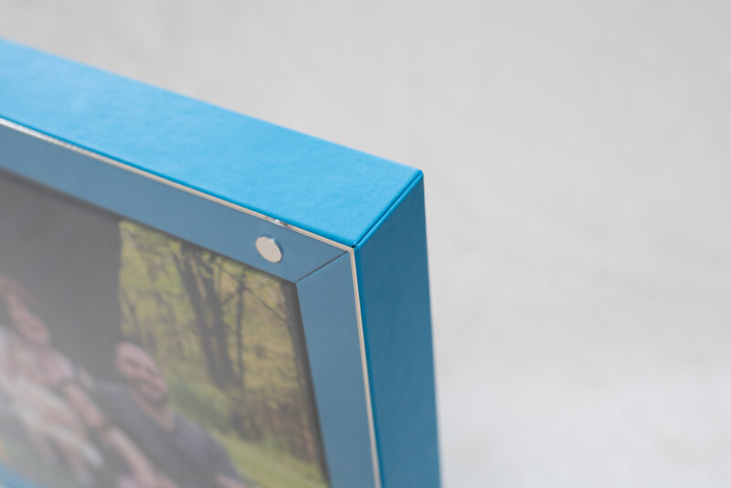 Corner details of the 12x12 heirloom album display box in blue with plexiglass and 4 corner magnets.