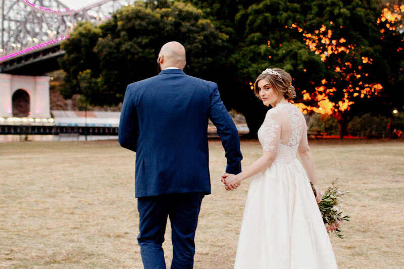 Bride and Groom walks while holding hands