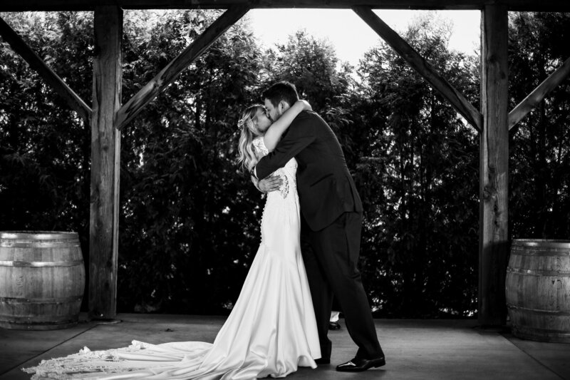 Bride and groom share first kiss at the end of their wedding at Quincy Cellars