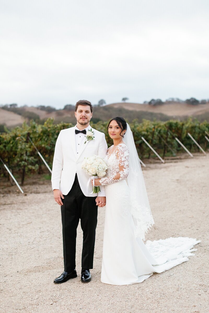 Bride and groom formal portrait at a black tie vineyard wedding