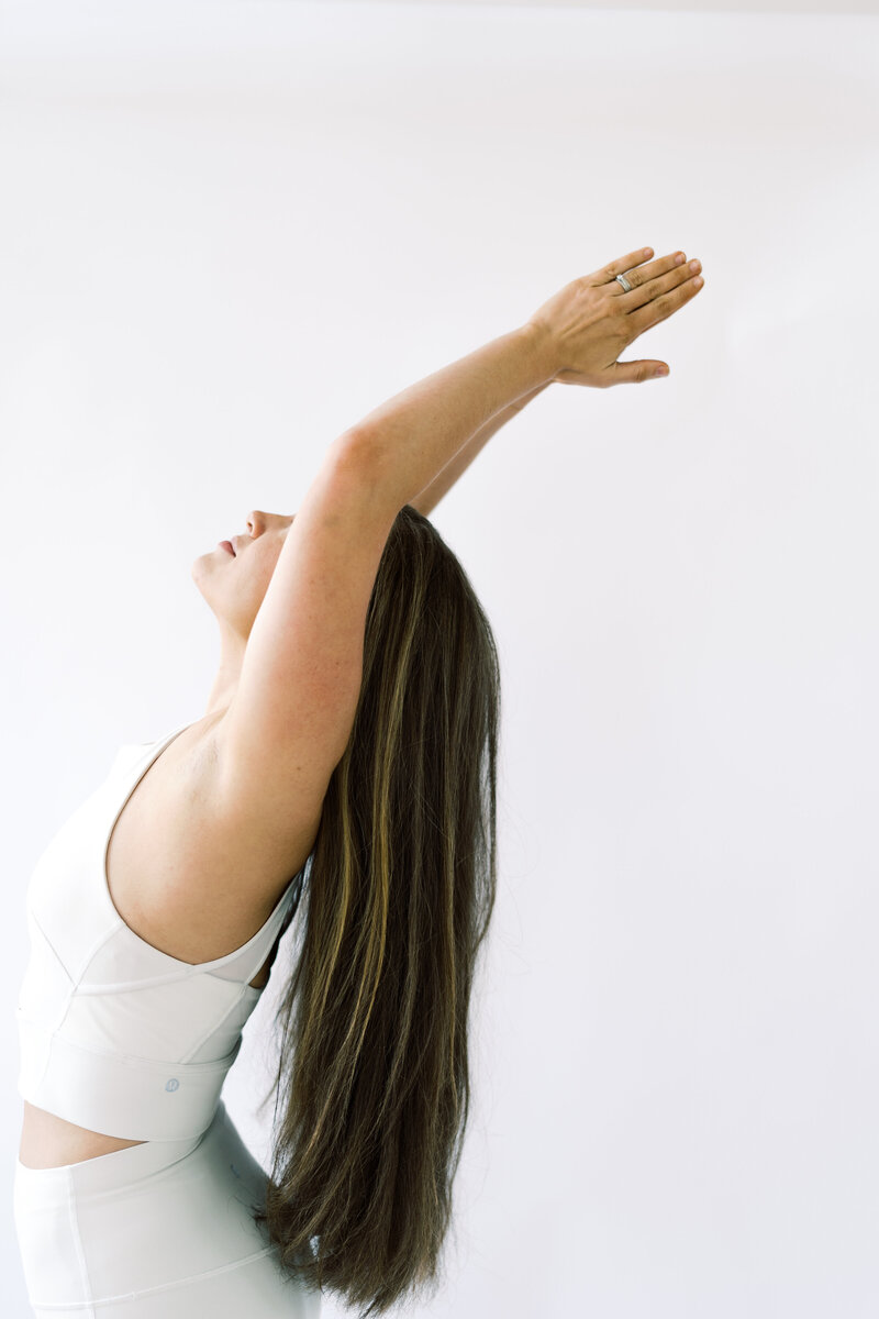 woman arching her back in yoga posture