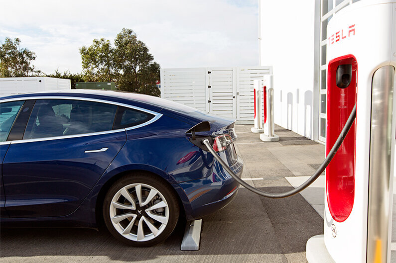 Tesla Electric Car at Charging station Photo Credit(adobe stock)