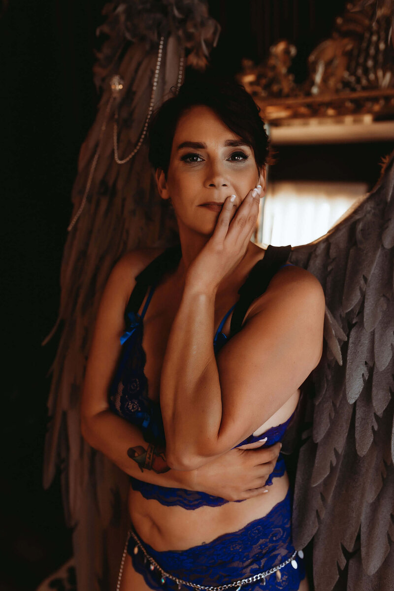 boudoir client wearing angel wings