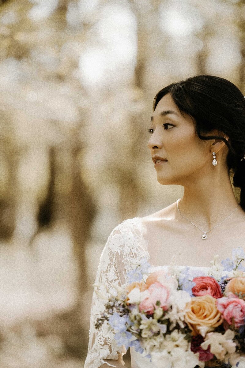 Asian-wedding-bride-outside-with-bouquet
