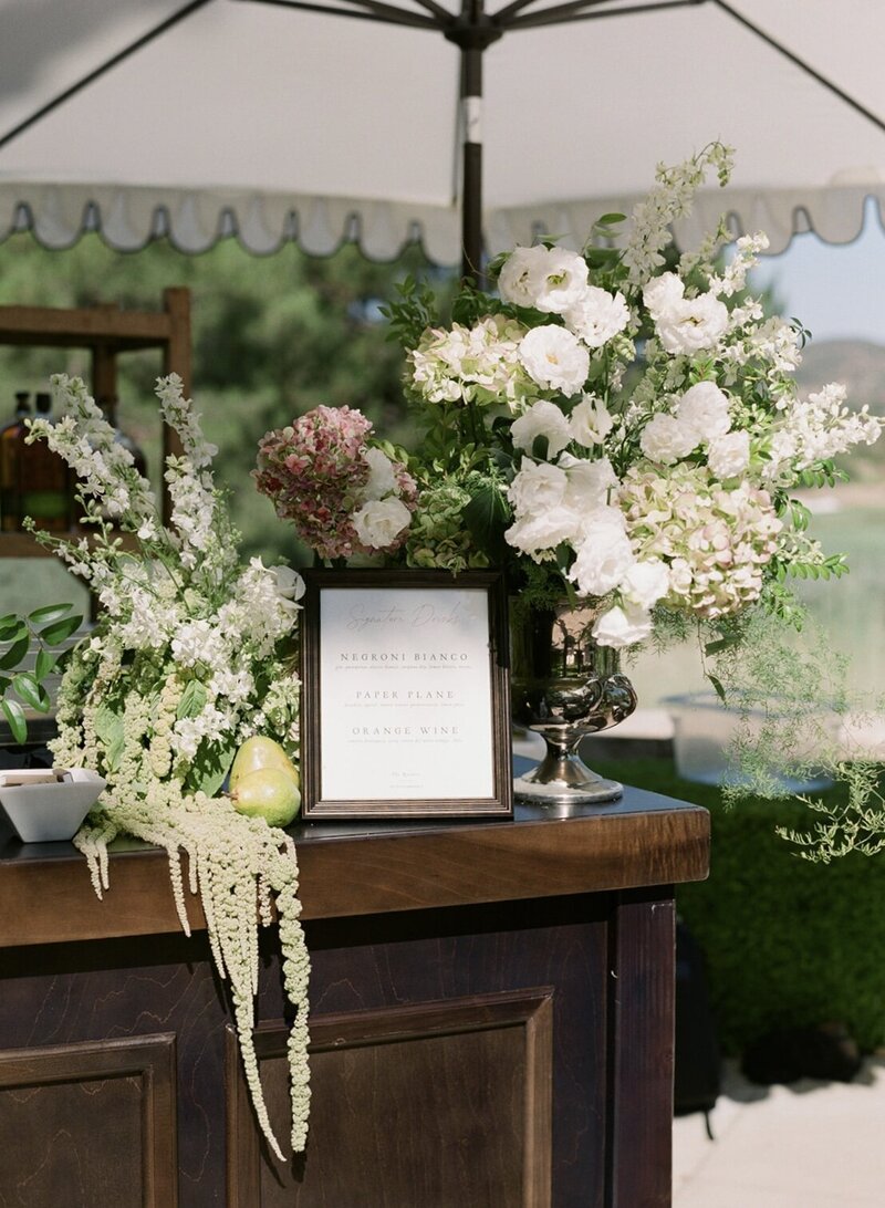 Close up of a long wedding table decorated with baby's breath flowers