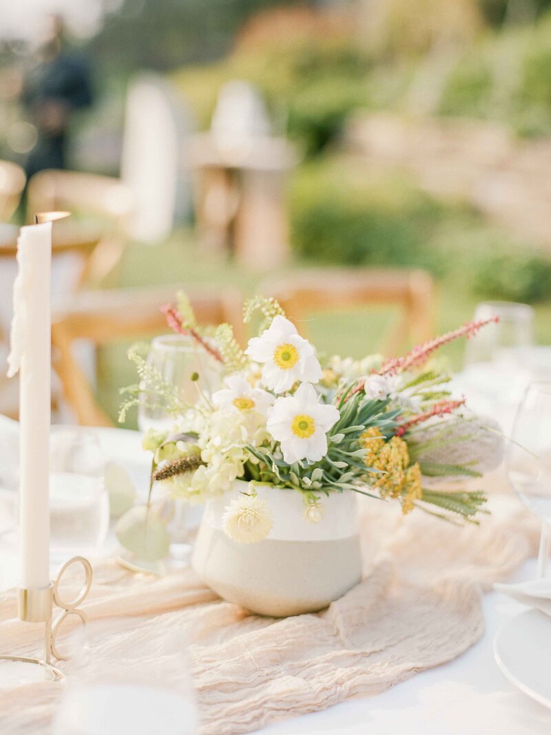 yellow and white floral centerpiece