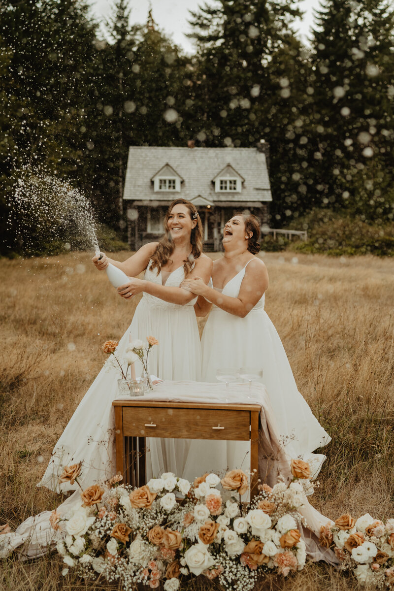brides popping champagne