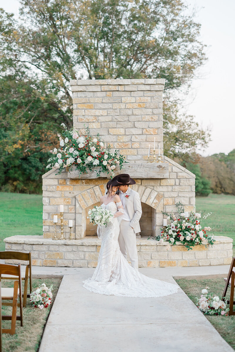 fire place mantel florals at wedding