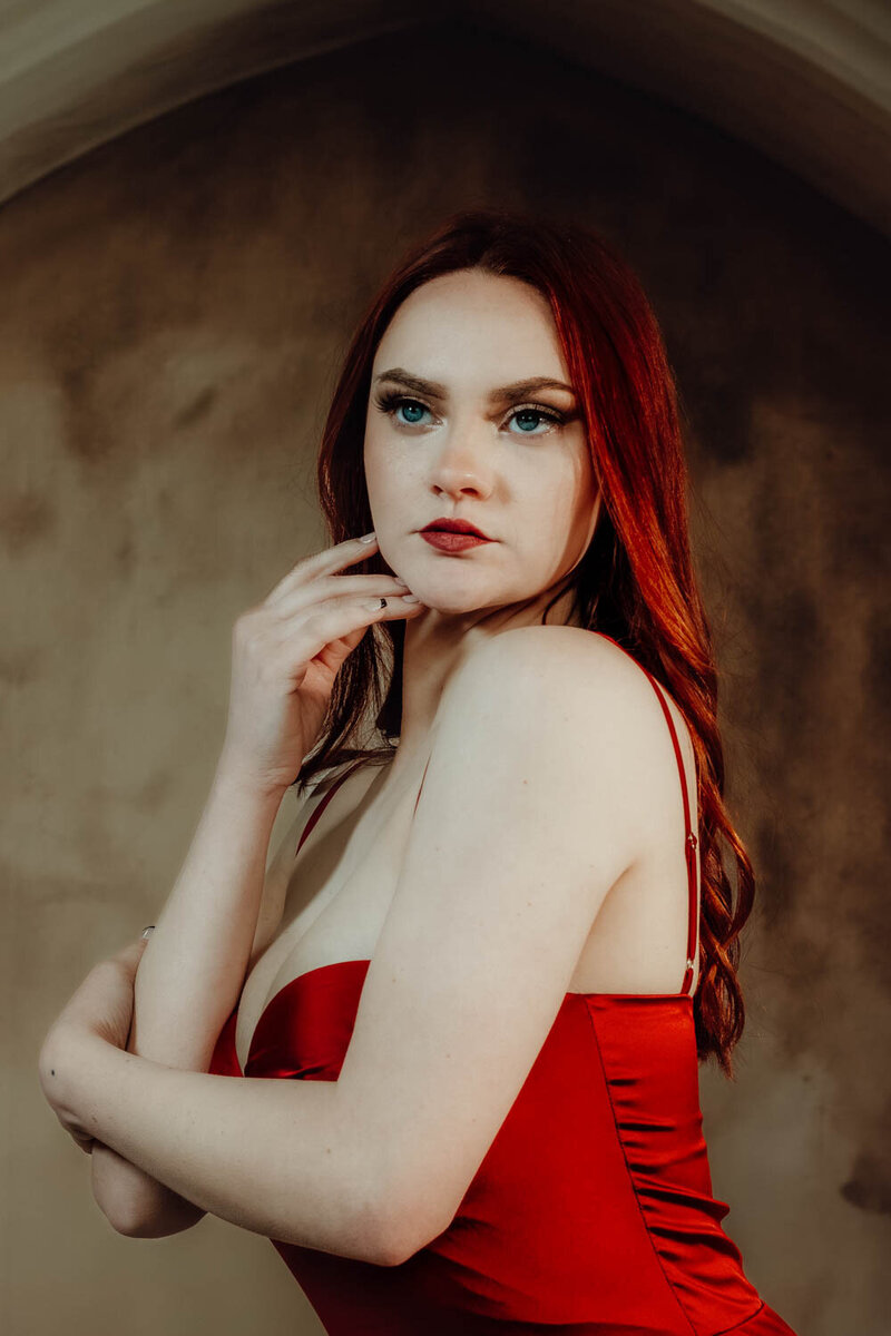 Senior portrait with lighting and bold, editorial fashion styling in Lansing, Michigan.