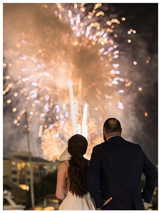 Couple enjoying Fireworks at Palafox Wharf in Pensacola FL