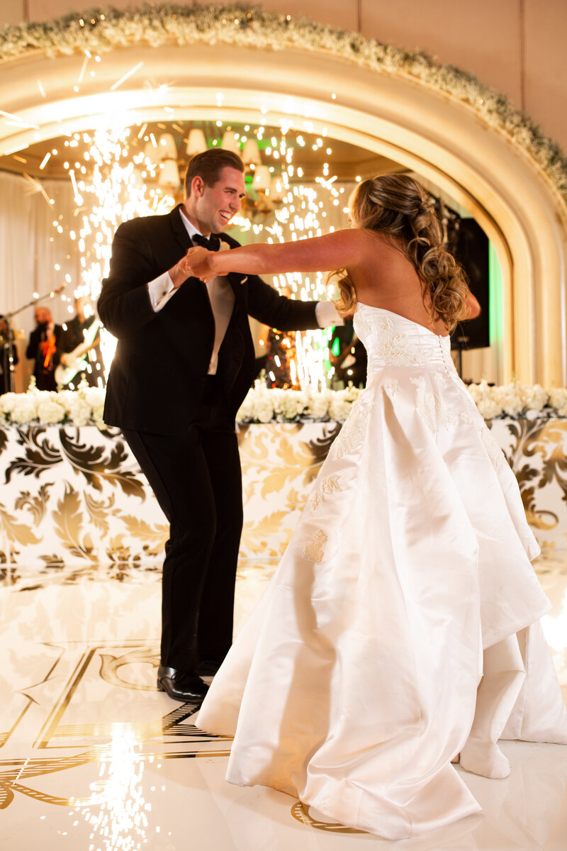 Sparks and a vinyl wrapped dance floor with the first dance couple and live band at Gaillardia Country Club in Oklahoma City
