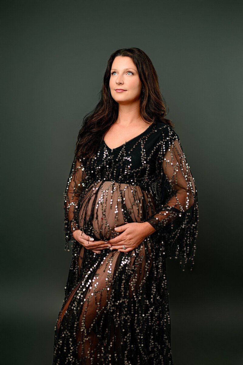 dark hair expectant charlotte mom in black sequined dress in waxhaw studio from client closet