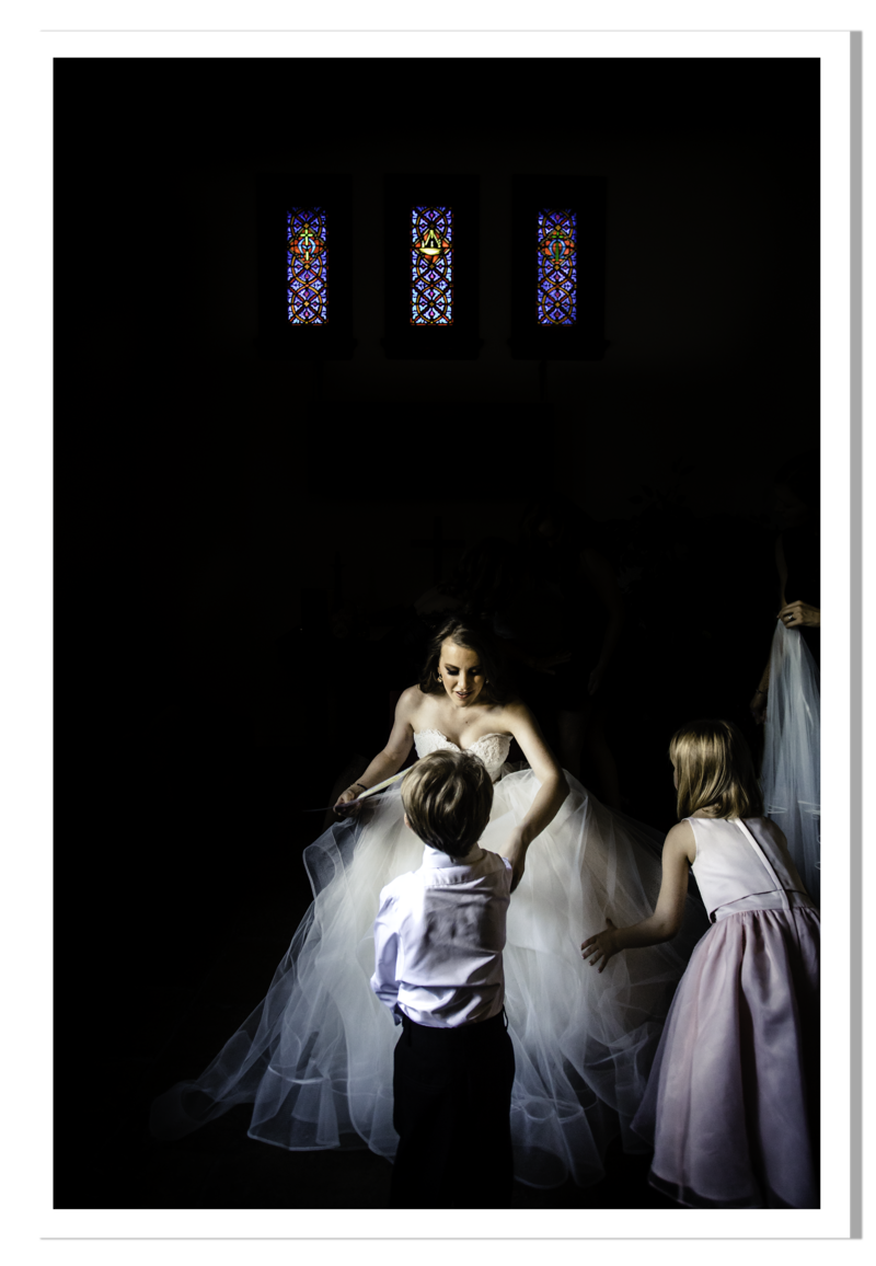 bride getting ready with flower girl and ring bearer