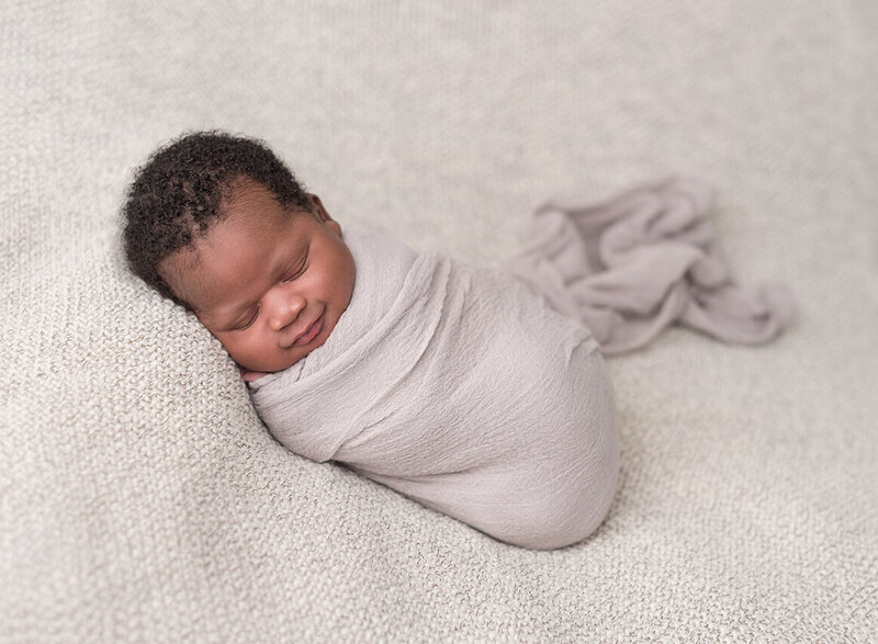 Smiling newborn photo by St. Louis photographer Laura King