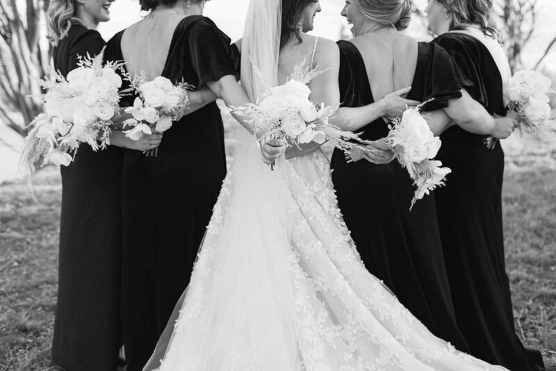 bridesmaids-link-arms-with-bride