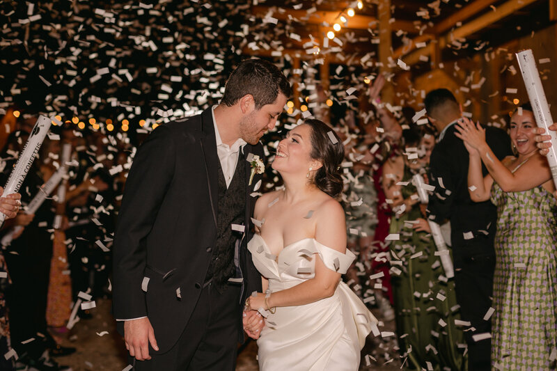 bride and grooms exit with confetti