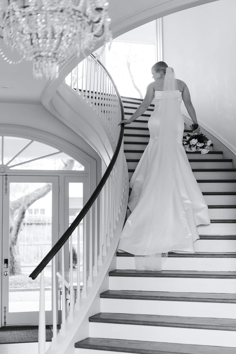 Houstons best wedding photographers Swish and Click Photography Houston bride walks up the stairs during her bridal session