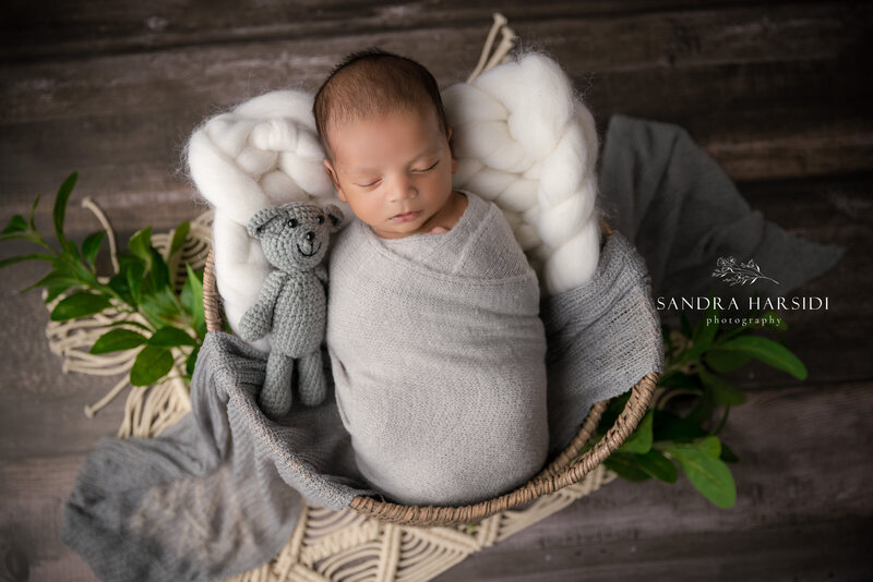 cute newborn baby with teddy bear