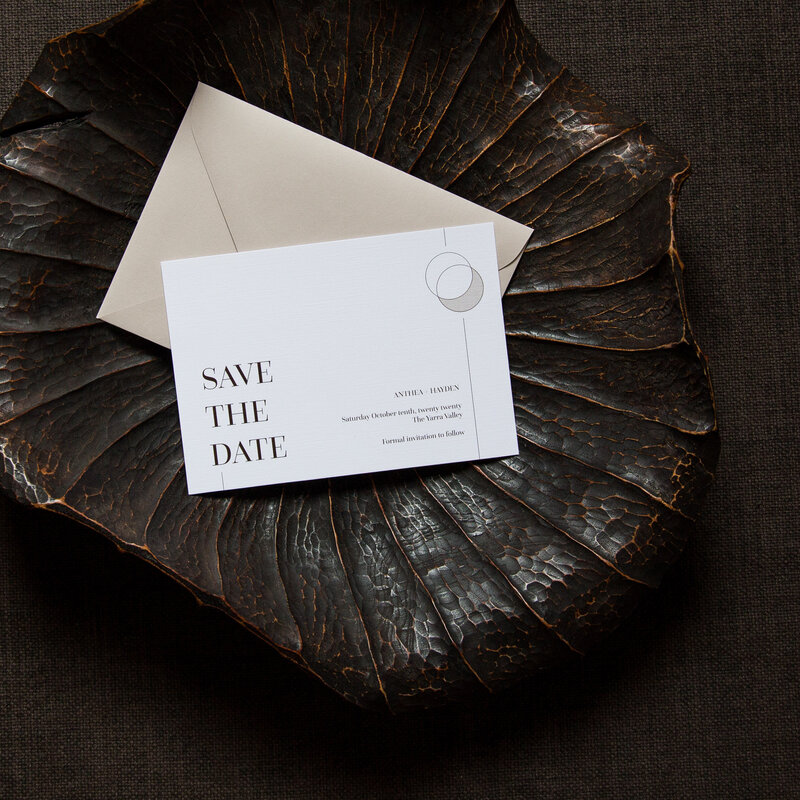 Brown contemporary save the date card with elegant moon graphic