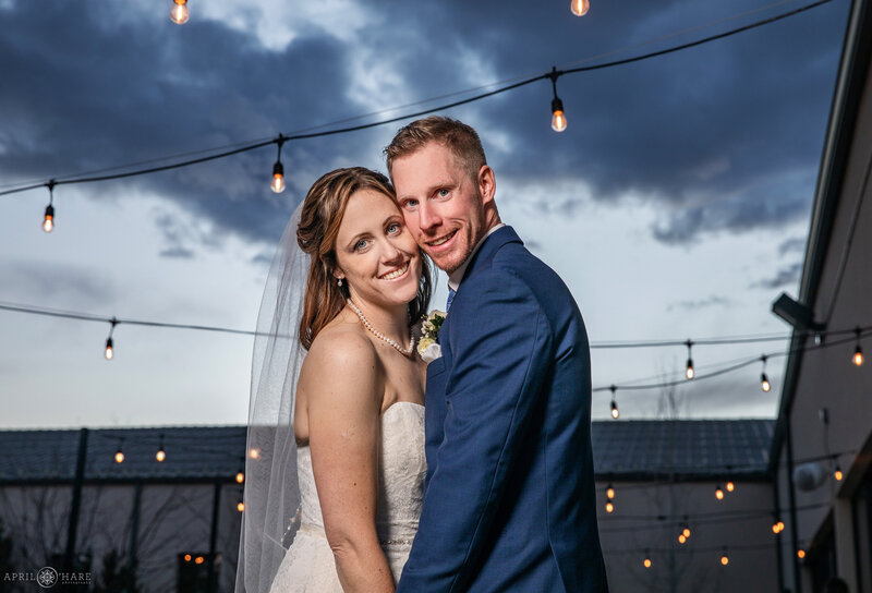 Couple photographed on the outdoor patio at Black Foreest by Wedgewood Weddings