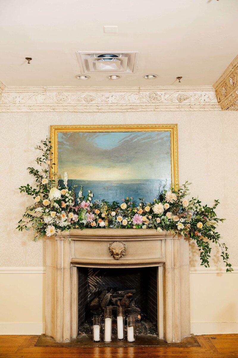 beautiful floral arrangement over fireplace