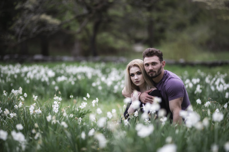 Couple's portrait on location in a field of flowers