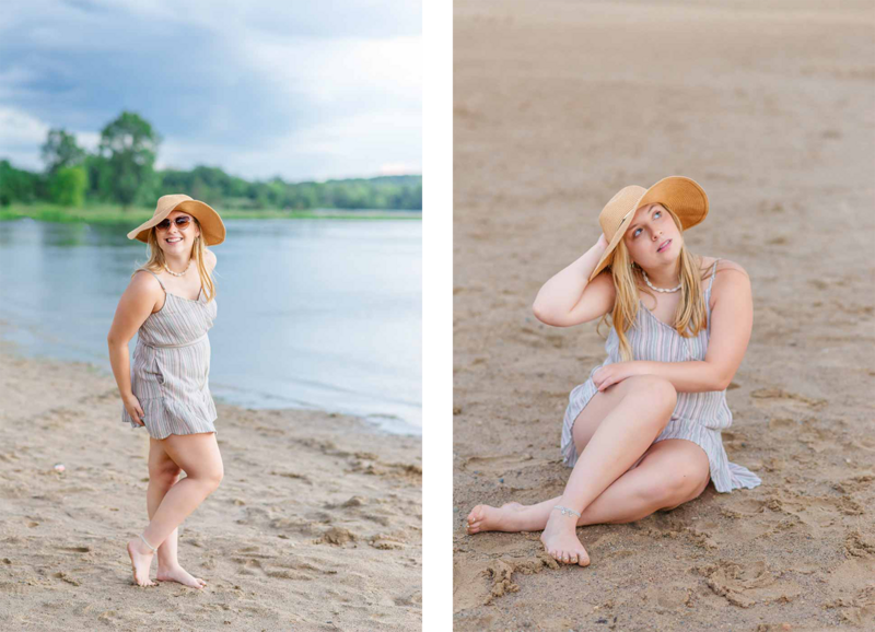 high school senior girl sitting and standing on beach at ionia state recreational park wearing a beach hat