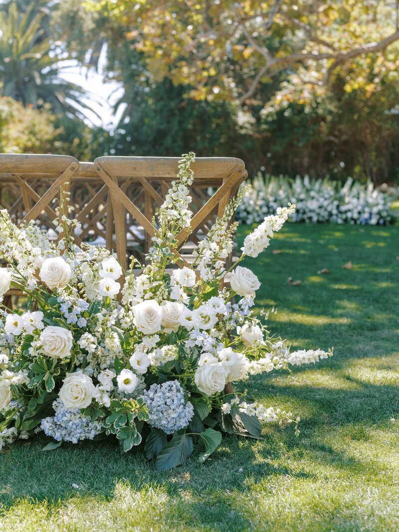 Line your wedding with large floral bouquets.