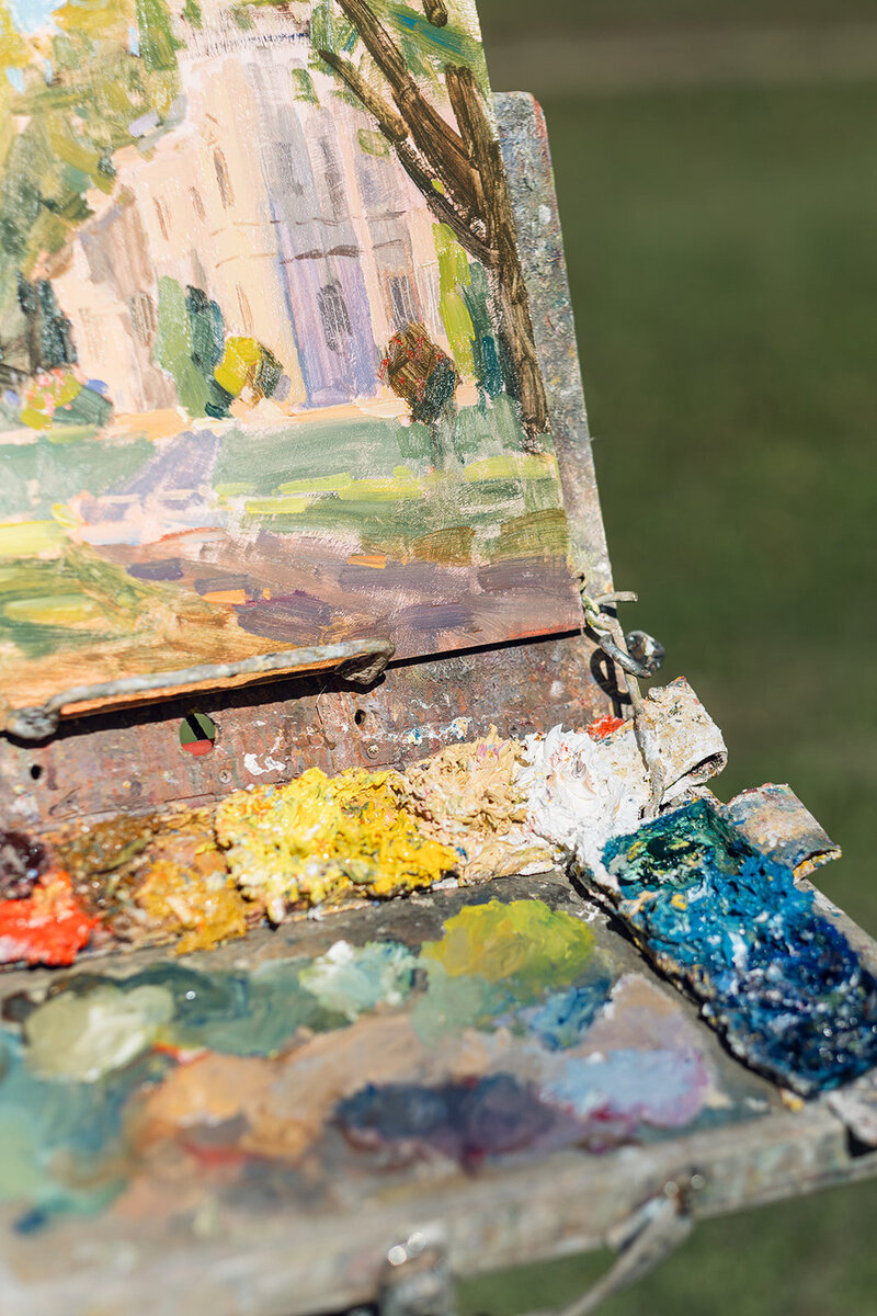 alérie Pirlot’s easel and paints set up for plein air painting at Chateau Charente in France
