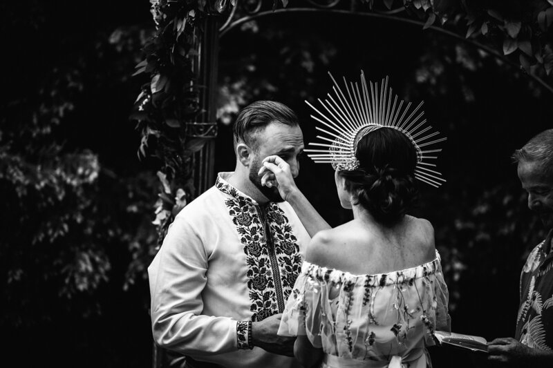 groom crying during first look with bride