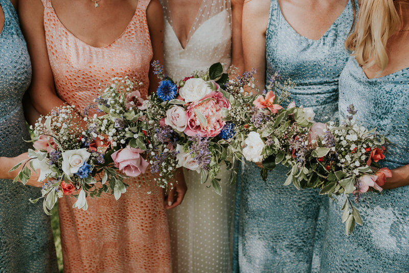 Colorful bouquets and bridesmaid dresses