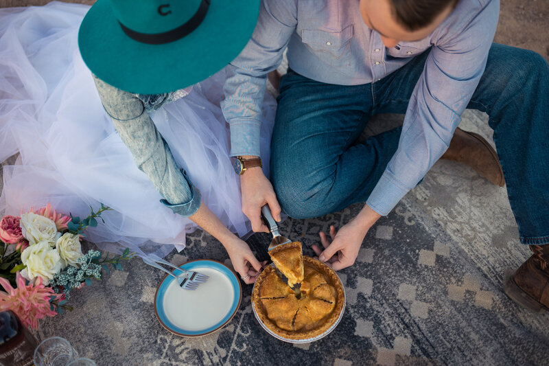 bride and groom cutting apple pie after their elopement