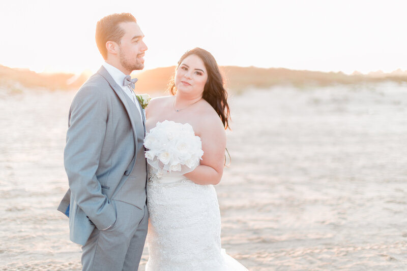 Bride and groom sunset portraits at the beach in Texas