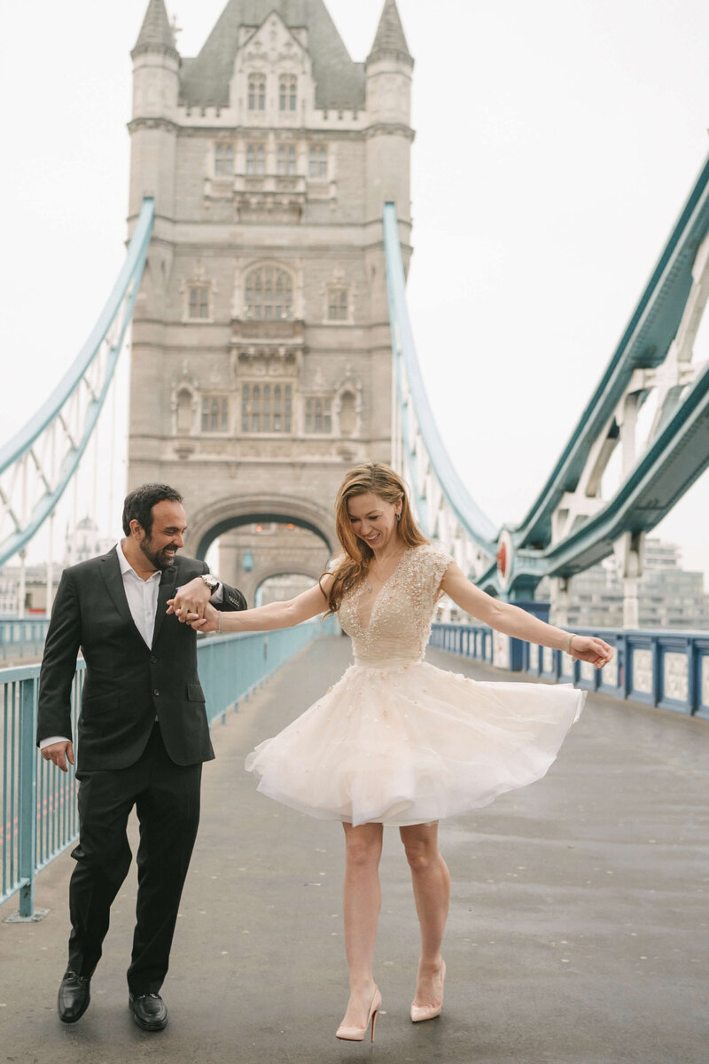 A bride and groom dancing on Tower Bridge