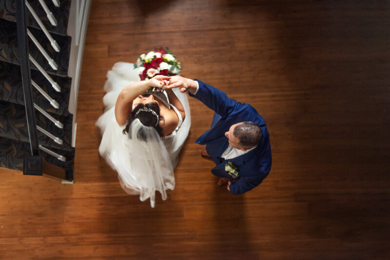 View looking down at a bride and groom dancing.